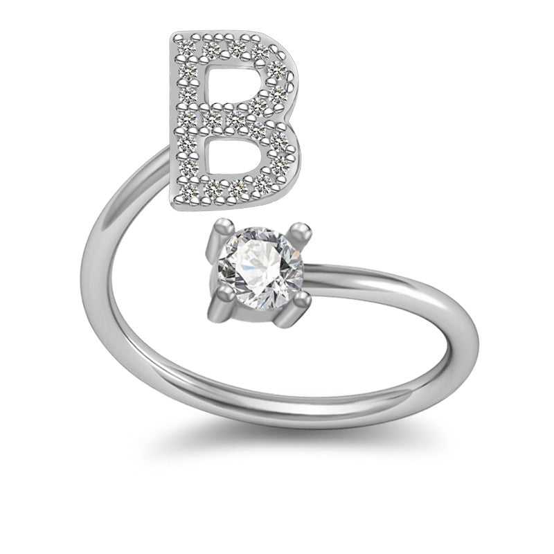 Ring formad som en bokstav, i koppar
