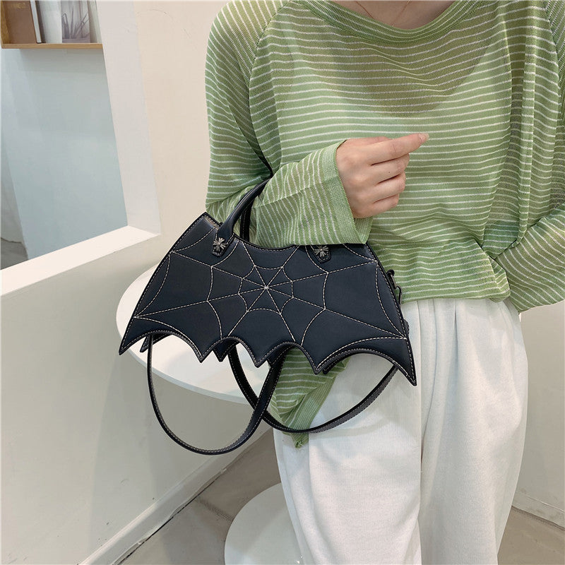 Väska formad som spindelnät – crossbody i PU